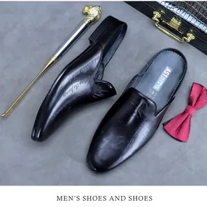 Macro shot of men's leather mule shoes with embossed details and branded insole