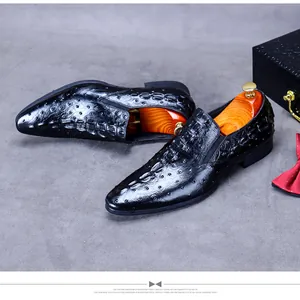 Detailed macro view of black crocodile embossed leather loafers with luxury shoe tree