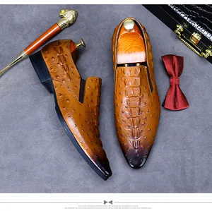 Detail of luxury brown alligator grain leather shoes with hand-stitched gradient toe cap