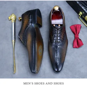 Detail view of premium leather men's oxford shoes with brown gradient and exotic texture