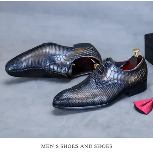 Detail of men's leather shoes featuring snake skin texture and woven pattern design