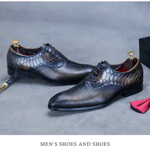 Detail of snake skin texture and woven leather on vintage brown pointed oxfords
