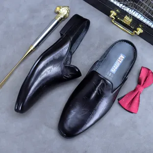 Men's black genuine leather mules with embossed lettering design for business casual wear