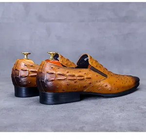 Detailed rear view of leather loafers featuring gradient finish and dual texture pattern