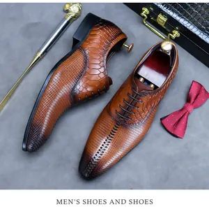 Brown leather dress shoes with scale texture displayed with vintage business accessories