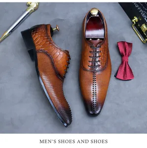Top view of premium brown oxford shoes with snake pattern textures and business accessories