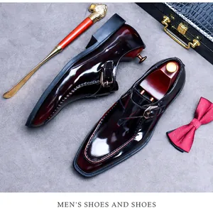 Polished wine red leather monk shoes with metal buckle and premium accessories