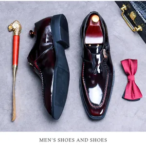 Macro view of burgundy monk strap formal shoes with glossy patent finish and leather texture