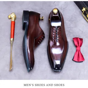 Close-up of premium brown leather dress shoes with classic bow tie and shoe horn