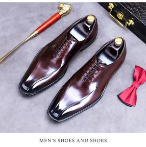 Polished burgundy leather oxford shoes with elegant silk bowtie and golden shoehorn