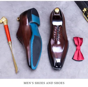 Detail of dark brown leather dress shoe with unique peacock blue anti-slip sole design
