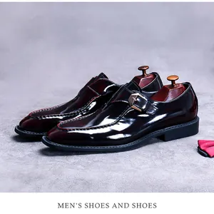 Close-up of premium monk strap shoe with glossy gradient burgundy leather and metal buckle