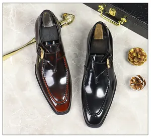 Polished leather monk strap shoes in black and burgundy with gold buckles and lion cane
