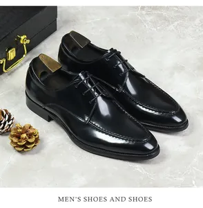 Detail of glossy black leather men's derby shoes with moc-toe stitching and metal shoe tree
