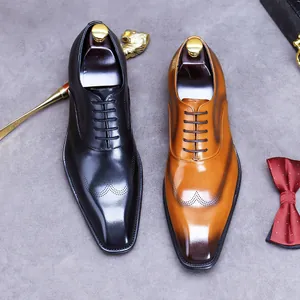 Κλασικά ανδρικά δερμάτινα παπούτσια oxford με brogue λεπτομέρειες σε μαύρο και καφέ