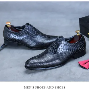 Detail of black oxford shoe featuring woven leather textures and crocodile embossing