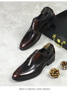 Detail view of premium dark brown leather derby shoes with patina finish on marble
