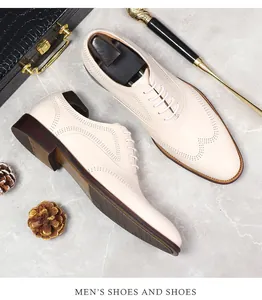 Detail of men's brogue oxford shoe with wingtip carving and dark non-slip sole