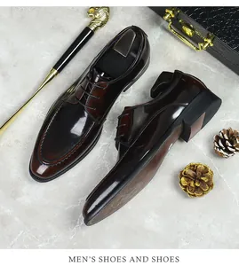 Detailed view of oxblood polished leather men's dress shoes with professional lace-up design