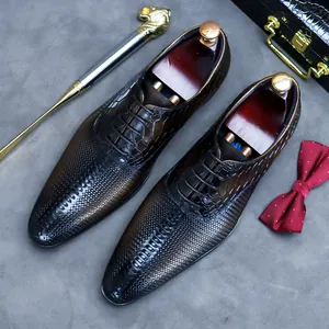Classic British style brown leather oxfords with crocodile pattern and woven texture