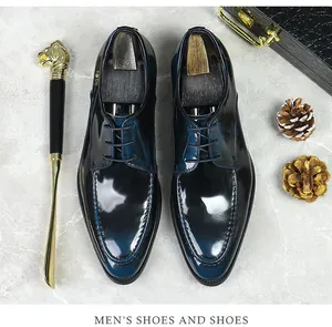 Macro view of men's leather business shoes with blue patina finish and four-hole lacing