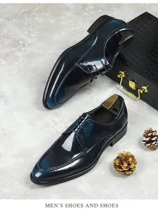Detailed top view of glossy navy gradient leather derby shoes on marble background