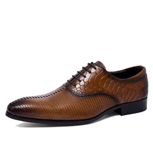 Brown leather Oxford dress shoes with textured crocodile pattern and woven leather finish