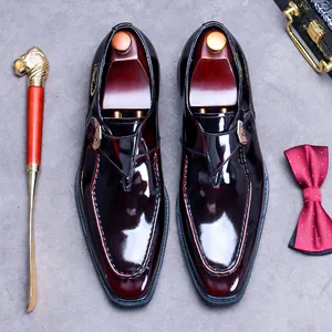Polished burgundy leather monk strap shoes for men with classic buckle and square toe detail