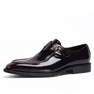 Polished burgundy monk strap leather shoes for men with gold buckle and U-tip stitching