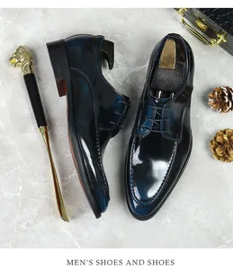 Polished patina gradient leather derby shoes shown with a lion-head handle shoehorn