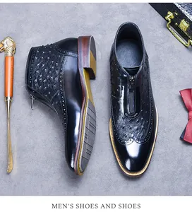 Detail of ostrich texture black leather boots with brogue carving and front zipper