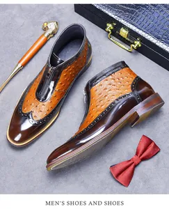 Detail of brogue shoes featuring brown leather, orange ostrich texture, and front zipper