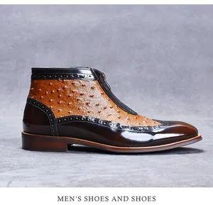 Close-up of ostrich texture and brogue detailing on men's pointed leather boots