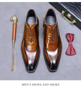 Gros plan de bottines en cuir marron dégradé pour hommes avec fermeture éclair