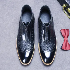 Men's black patent leather pointed boots with ostrich pattern and front zipper