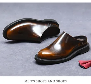 Macro detail of men's brown gradient leather mules with polished finish and rubber sole