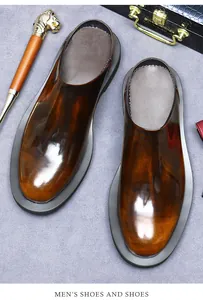 Polished gradient brown leather mule shoes for men paired with business accessories