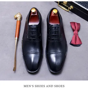 Macro detail of black leather oxford shoes with elegant brogue patterns and wooden shoe trees