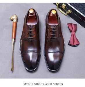 Deep brown leather Oxford shoes with brogue details and elegant gradient finish