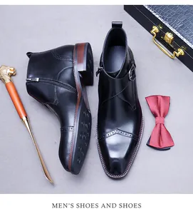 Close-up of black leather brogue boots with side zipper and elegant monk strap