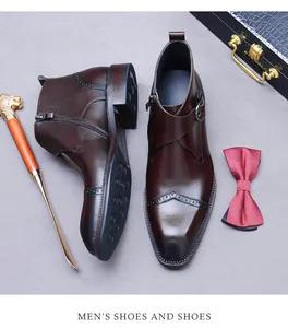 Detailed top view of dark brown leather boots with brogue carving and side zipper