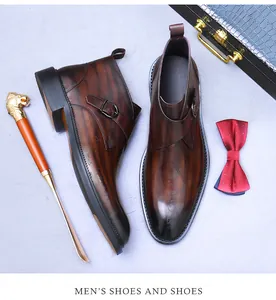 Detailed top view of brown leather monk strap boots with stylish embossed patterns