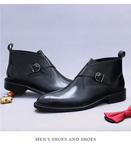 Detail of black leather monk strap boots featuring silver buckle and side embossing
