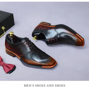 Detail of square-toe gradient leather men's dress shoe with contrast orange sole edge