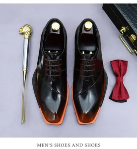 Close-up of polished dark brown men's dress shoe with contrasting orange sole and accessories