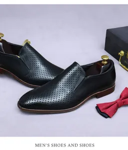 Detail of black hollowed leather men's business shoe with breathable laser-cut patterns