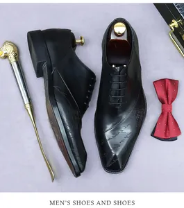 Men's black leather business shoes with elegant cursive script and shield texture details