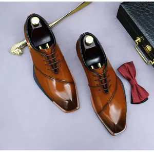 Detail view of premium brown gradient leather dress shoes with professional business accessories