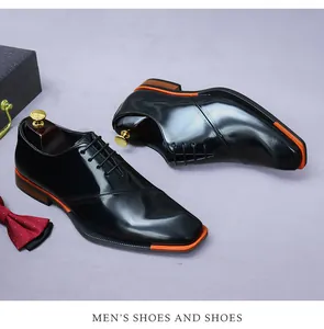 Formal black leather oxfords with square toe design and brown contrast sole detail