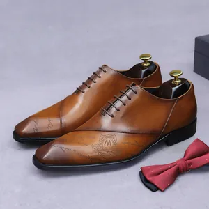 Classic vintage brown leather oxford dress shoes for men with luxury laser engraved details